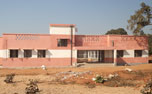 A school building with finished facade under contruction at Tokisud site